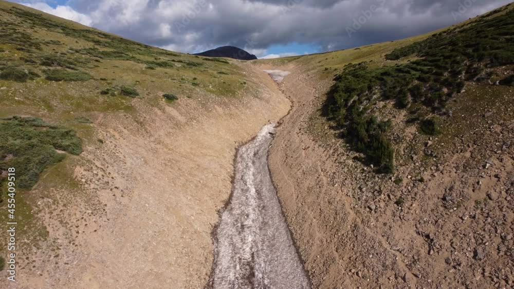 Revealing snow shelf between valley in Colorado Rocky Mountains, aerial Revealing snow shelf between valley in Colorado Rocky Mountains, aerial