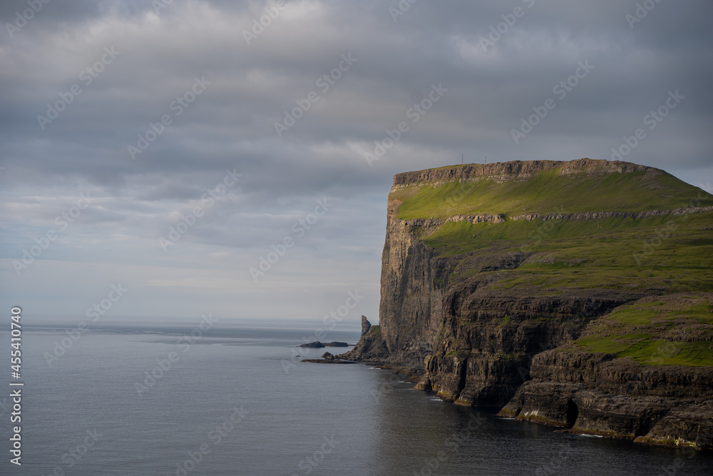 Naklejka premium Beautiful aerial view of the Tjornuvik village in the middle of the Mountains in Faroe Island