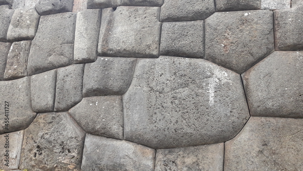 Fototapeta premium stone wall patterns of inca ruins in peru 