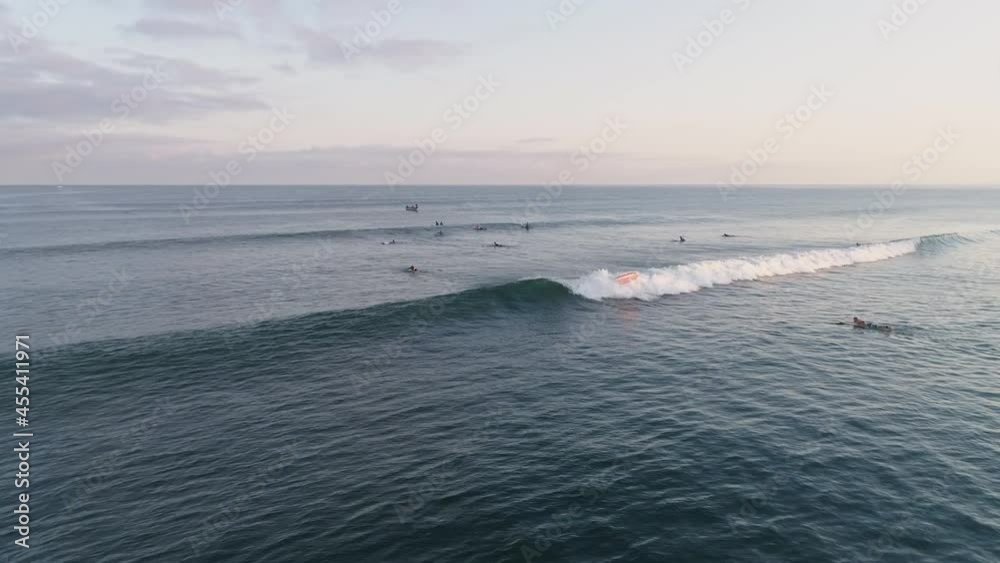 Aerial of surfer riding wave towards camera and eventually falling, 4K Aerial of surfer riding wave towards camera and eventually falling, 4K