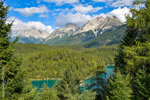 Scenic mountains and emerald lake panorama landscape