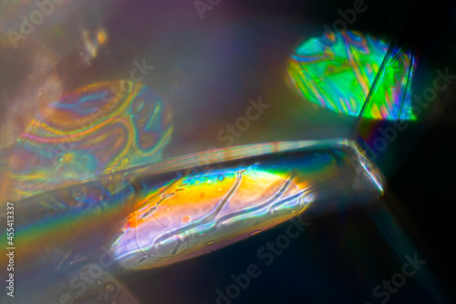 View into a microscopic world of soap bubbles, uncovered light, artistic multicolored surreal detail.