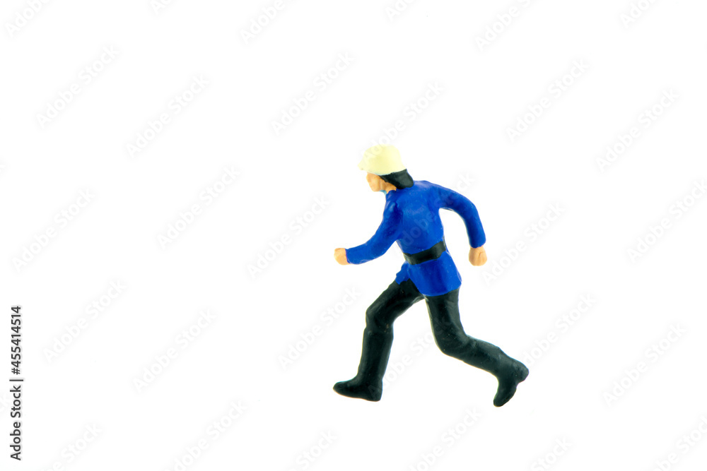 Miniature people engineer worker construction concept on white background with a space for text Miniature people engineer worker construction concept on white background with a space for text