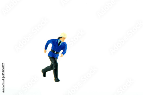 Miniature people engineer worker construction concept on white background with a space for text