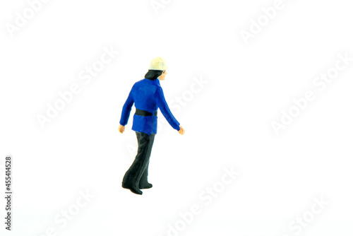Miniature people engineer worker construction concept on white background with a space for text © สุธากร รอดเรืองฤทธิ์