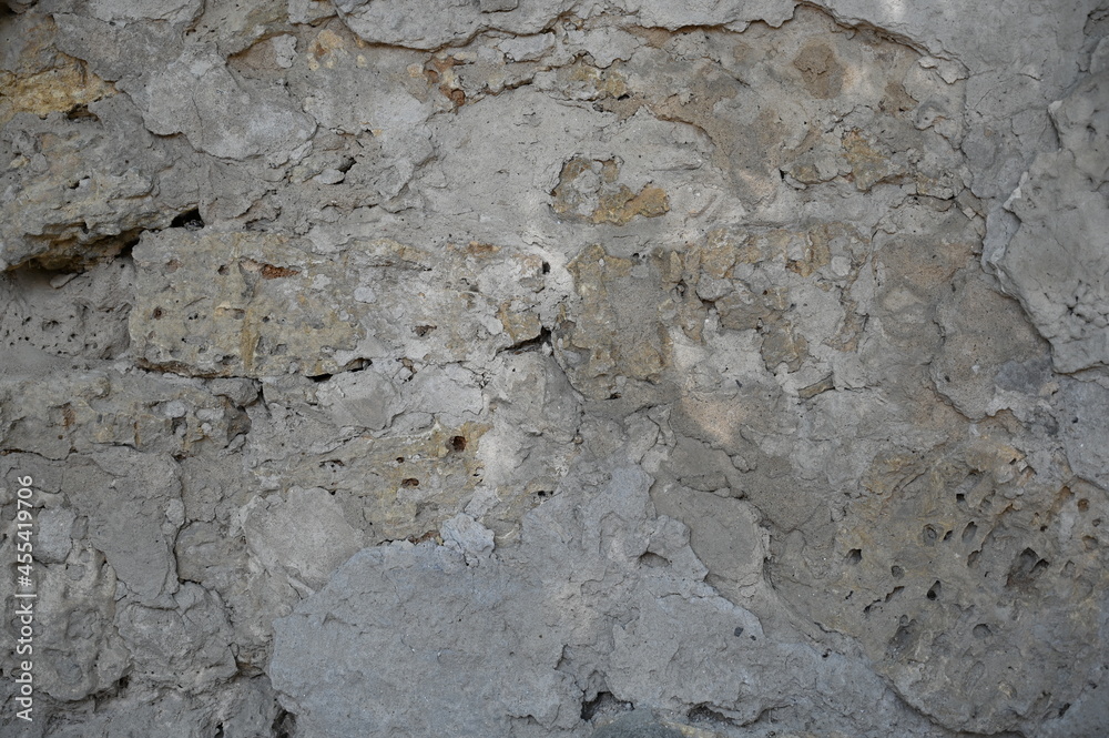 Old dirty wall close up. Grunge abstract photo background.  Beautiful stone texture pattern.
