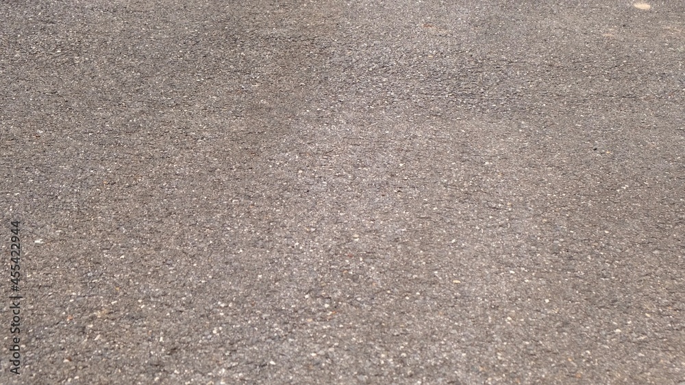 Crack on gray asphalt texture background. Road construction and design concept. Worn out bad asphalt Crack on gray asphalt texture background. Road construction and design concept. Worn out bad asphalt