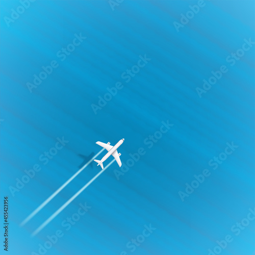 Jetliner flight above the blue sea on top speed. Aircraft with turbines trace and shadow. Template for design with copyspace
