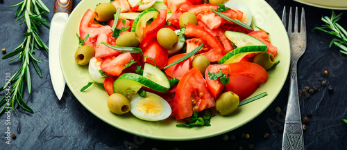 Fototapeta Naklejka Na Ścianę i Meble -  Salad with vegetables, olives, eggs and rosemary