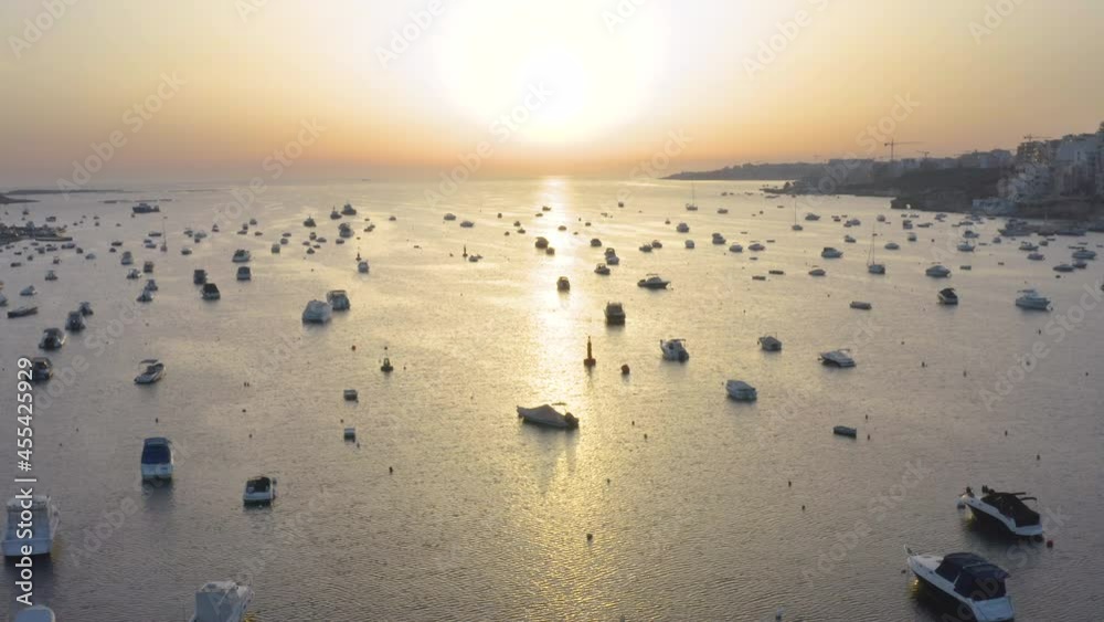 Sunset over harbor marina with countless boats and yachts,Malta,aerial.