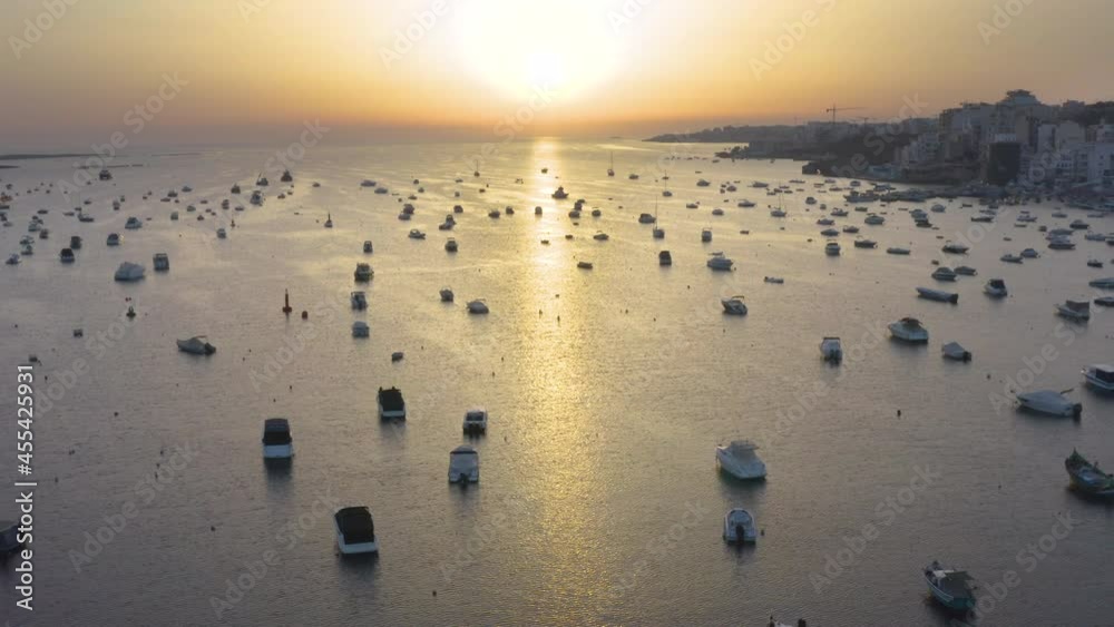 Sunset over bay harbor with countless yachts and boats,Malta,aerial. Sunset over bay harbor with countless yachts and boats,Malta,aerial.