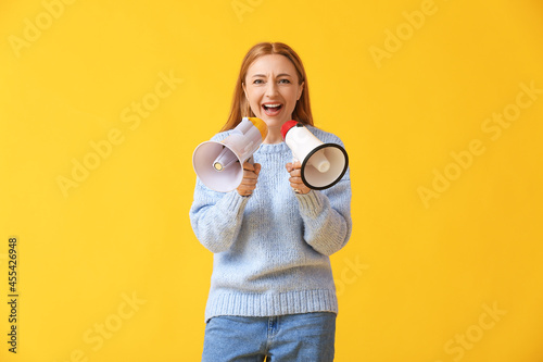 Mature woman shouting into ...