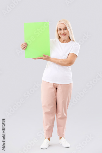 Mature woman with blank pap...