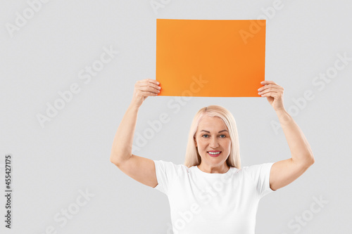 Mature woman with blank pap...