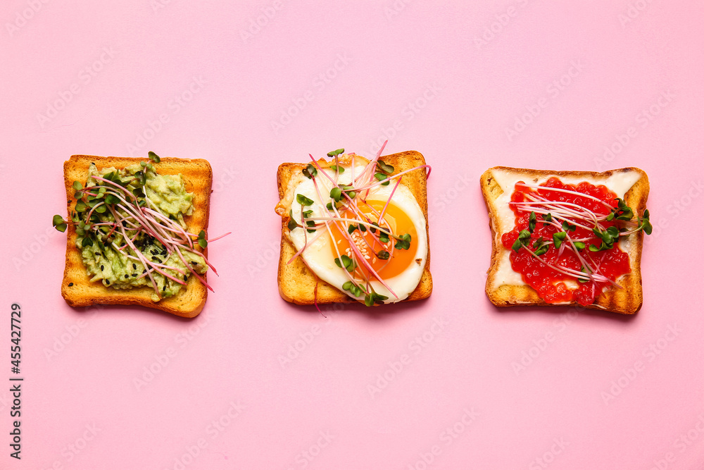 Different toasts with micro green on color background Different toasts with micro green on color background