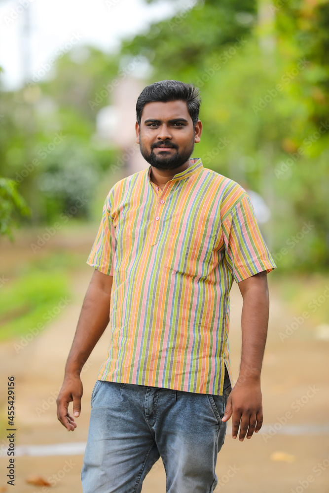 Young indian farmer in traditional wear and giving expression. Young indian farmer in traditional wear and giving expression.