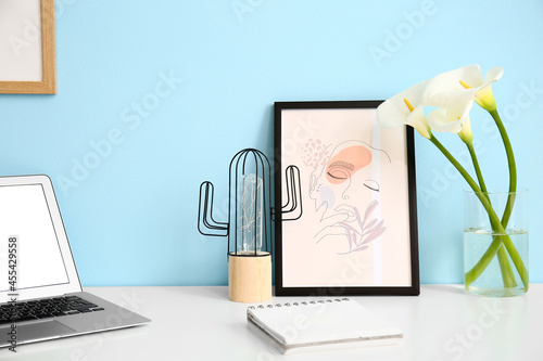 Vase with flowers and pictu...