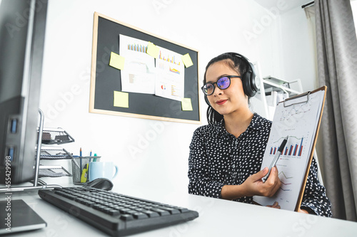 Beautiful young woman in casual clothing using computer and video conference remote working discuss concersation about strategy business planing while working indoor.