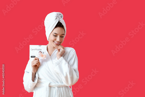Young woman with gift certi...