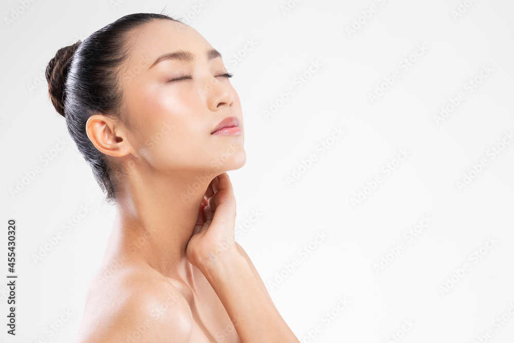 Relaxing Asian young woman close her eyes touch her neck deep breath and comfortable.Calm of wellness beautiful japanese woman resting with healthy pure and fresh skin after spa facial treatment Relaxing Asian young woman close her eyes touch her neck deep breath and comfortable.Calm of wellness beautiful japanese woman resting with healthy pure and fresh skin after spa facial treatment