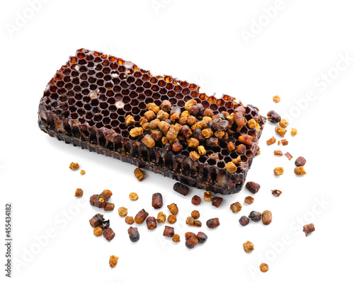 Honeycomb and beebread on white background photo