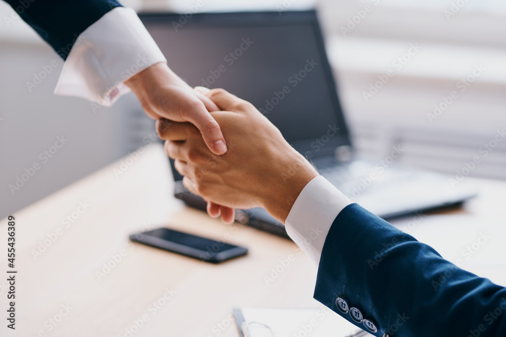 managers shaking hands successful deal office laptop professionals