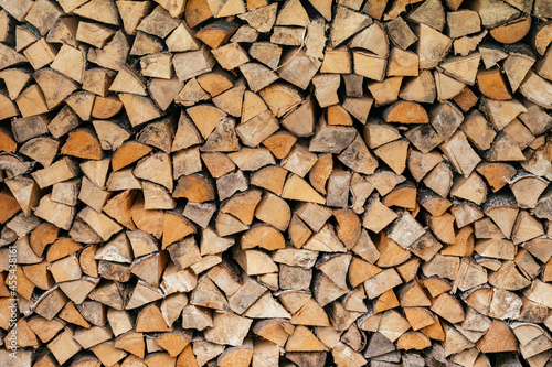 Texture background image of chopped firewood stacked in a woodpile  copy space