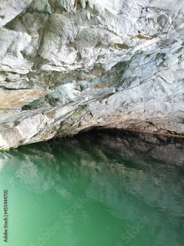 The wall of the grotto  reflected in the emerald water of the Marble Canyon in the Ruskeala Mountain Park.