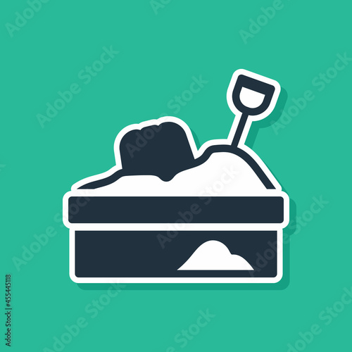 Blue Sandbox with sand icon isolated on green background. Vector