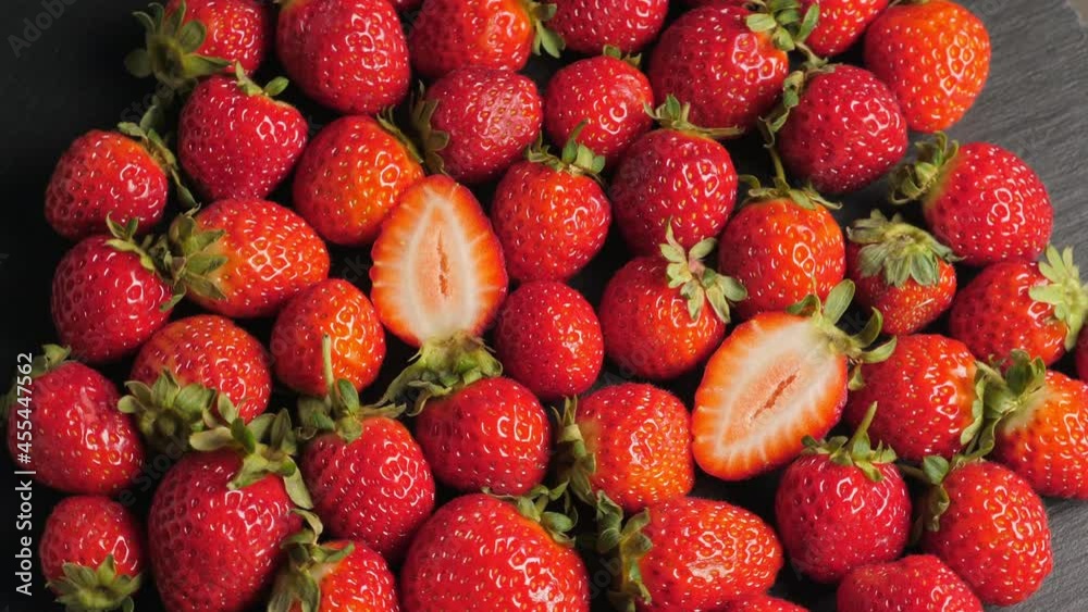 A lot of ripe and fresh strawberry. Closeup. Rotating A lot of ripe and fresh strawberry. Closeup. Rotating