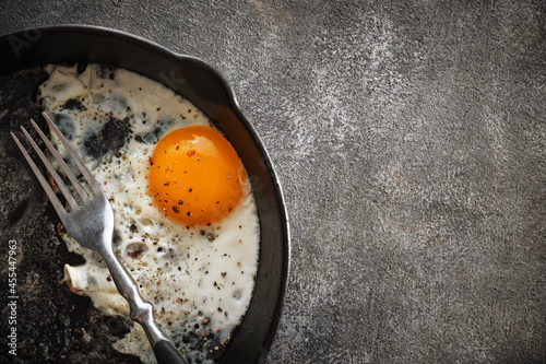 Fried chicken egg in a cast iron pan