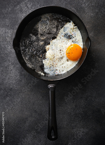 Fried chicken egg in a cast iron pan