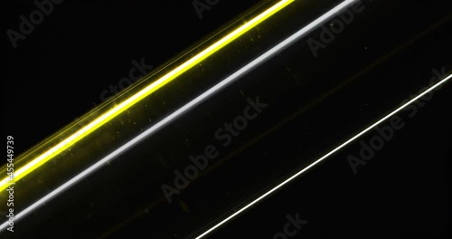 Macro shot. Oil in a test tube. Dark background. Concept. Parallel lines. Oil flowing through a glass tube. Energy. Motor fuel. Essential cosmetic extract. Oil filtration