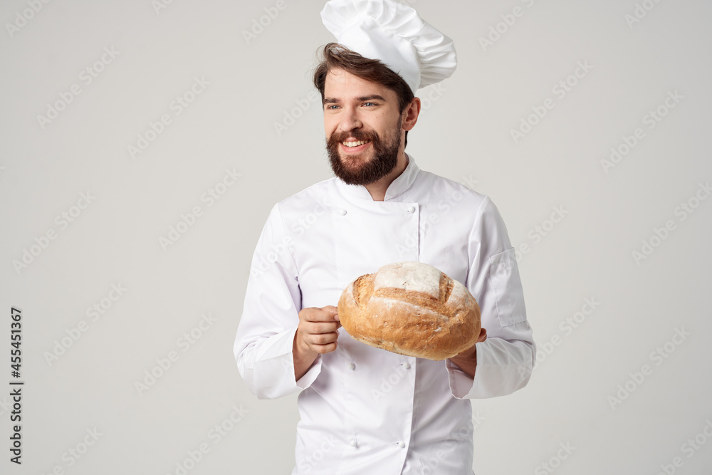 male cook with bread in hand culinary industry male cook with bread in hand culinary industry