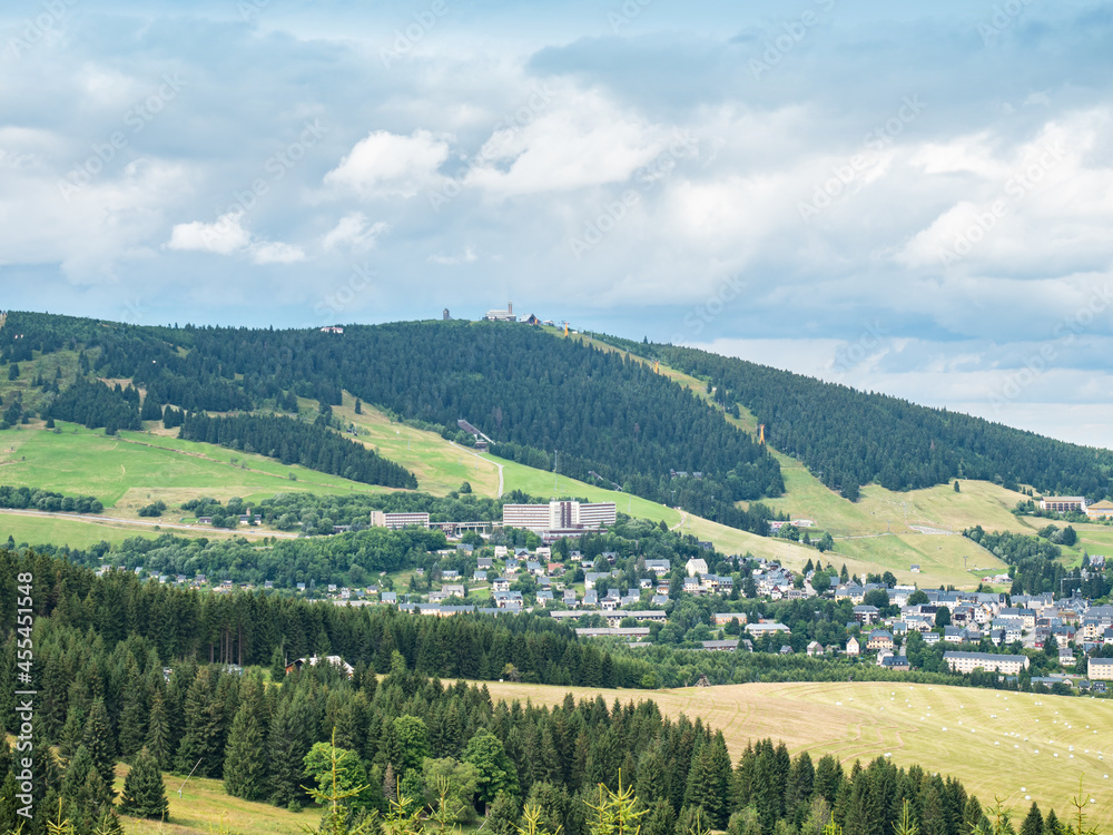 Oberwiesenthal in the Erzgebirge Mountains with Fichtelberg mountain peak i
