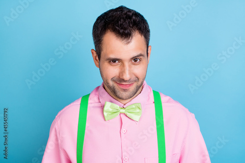 Photos Photo of funny brunet hairdo man look wear pink shirt isolated on blue color bac
