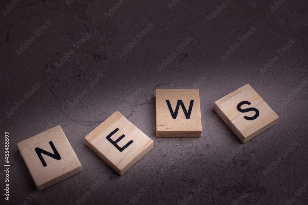 Top view of wooden blocks with letters -text news Top view of wooden blocks with letters -text news