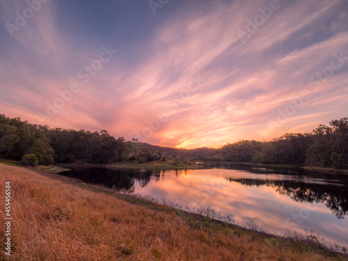 Beautiful Lakeside Sunset with Cloud Reflections