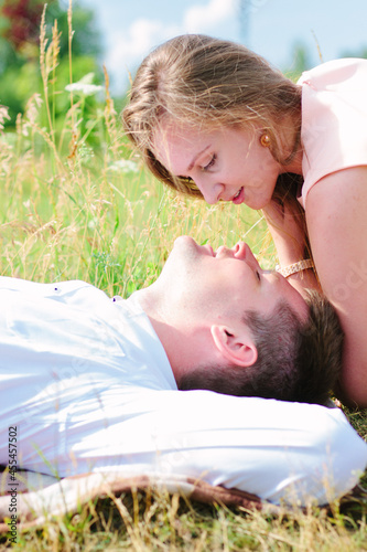 Girl and man couple laying ...