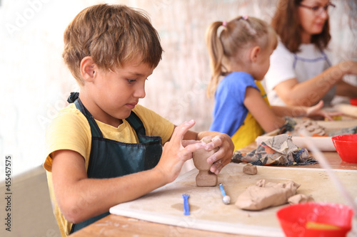 Kids molded from clay at pottery class. 