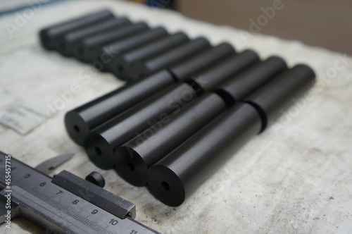 Obraz na plátně Polyamide parts on lathe machine with trammel