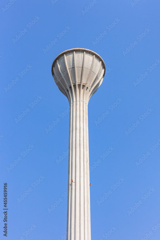 Tall High Water Tower Structure Storage Tank with Gravity Feed for Drinking to Residential homes. Tall High Water Tower Structure Storage Tank with Gravity Feed for Drinking to Residential homes.