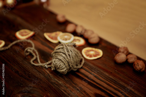 elements of Christmas decor (dried lemon, lime and orange wedges on a wooden board)
