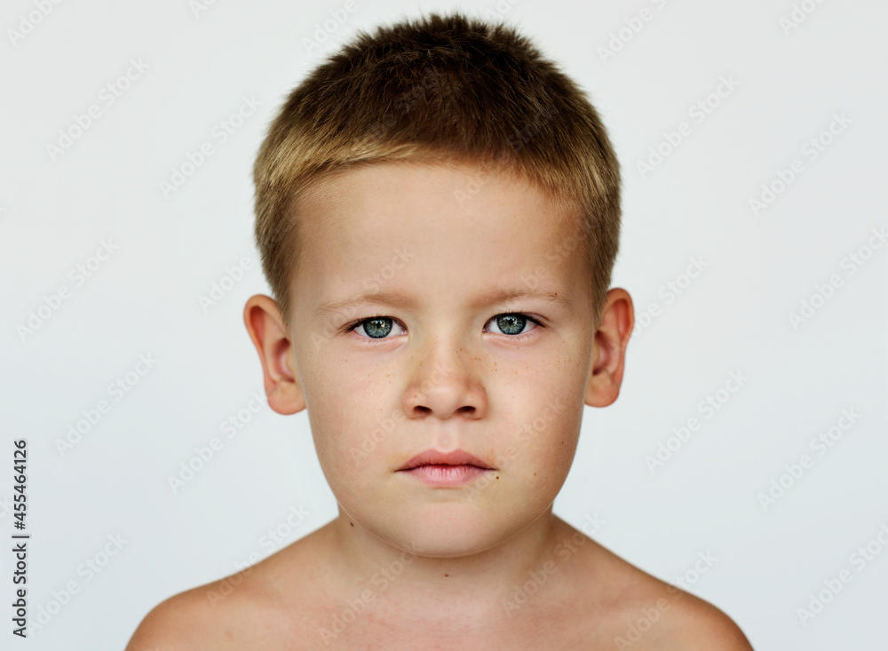 Portrait of a young kid with a serious expression Portrait of a young kid with a serious expression