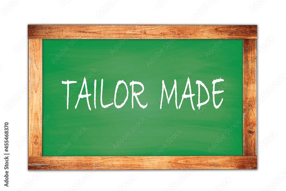 TAILOR MADE text written on green school board. TAILOR MADE text written on green school board.