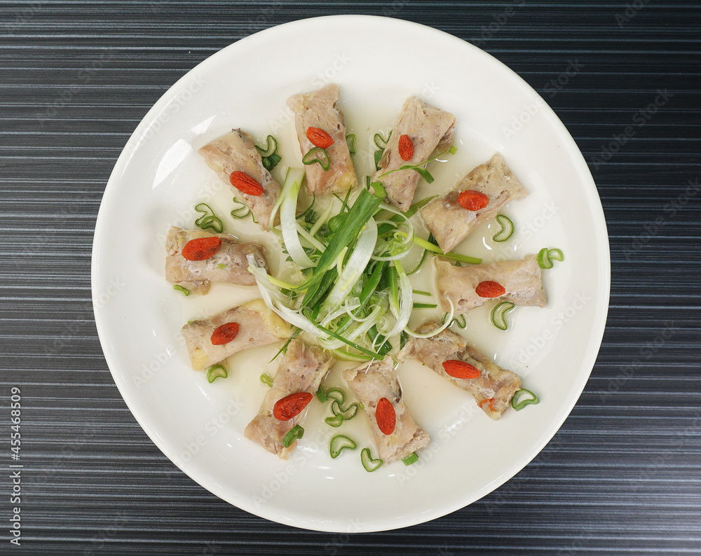 steamed chinese herbal chicken wrapped meat shape on dark grey wood background dim sum halal menu steamed chinese herbal chicken wrapped meat shape on dark grey wood background dim sum halal menu