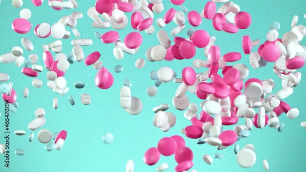 Super Slow Motion Shot of Flying Colorful Pills on Light Green Background at 1000fps. Super Slow Motion Shot of Flying Colorful Pills on Light Green Background at 1000fps.
