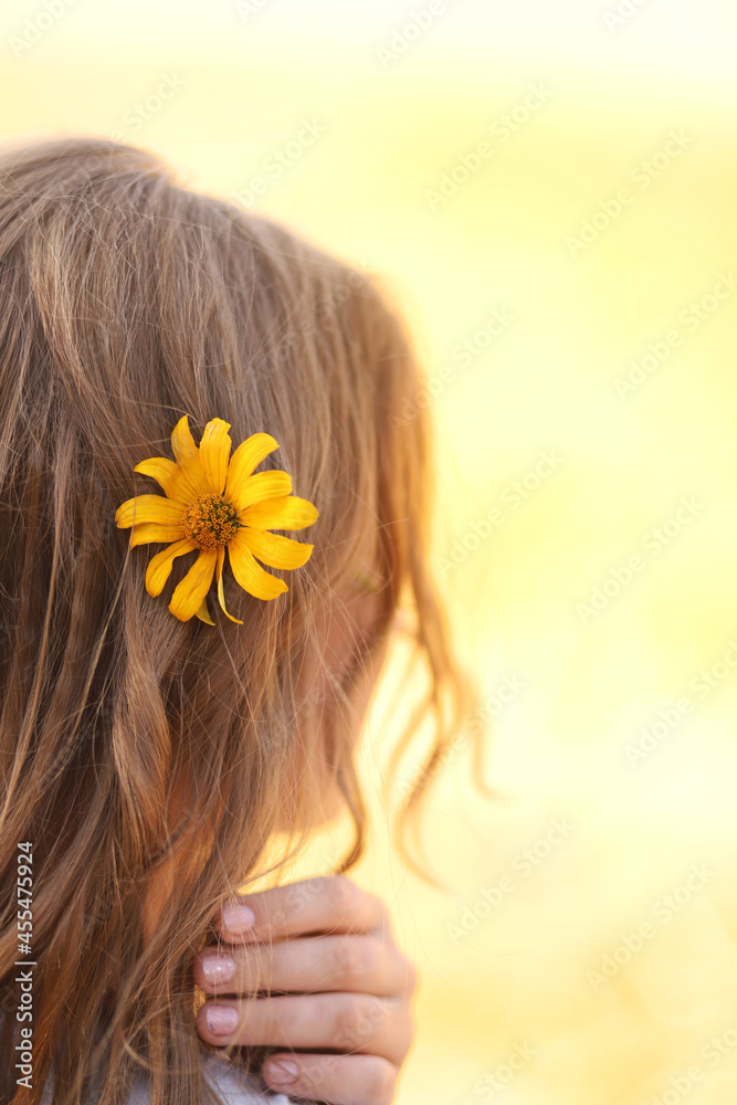 Naklejka premium beautiful girl with a flower in her hair