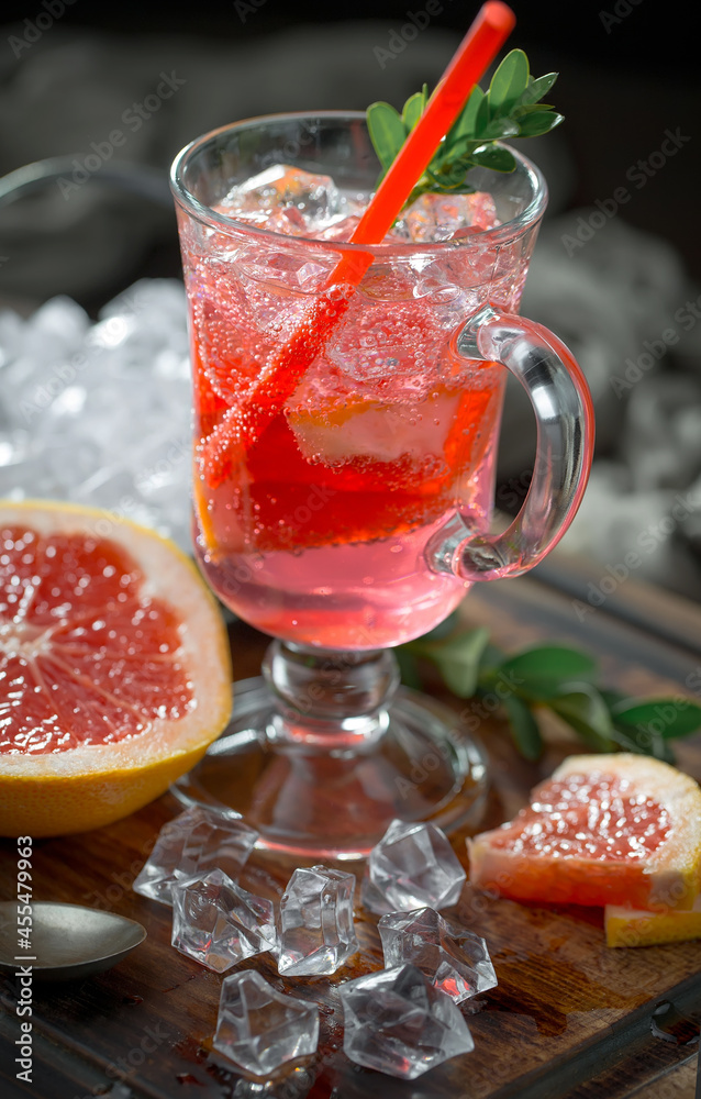 Fruit cocktail, in a glass with natural healthy fruits on a table with kitchen accessories. Fruit cocktail, in a glass with natural healthy fruits on a table with kitchen accessories.