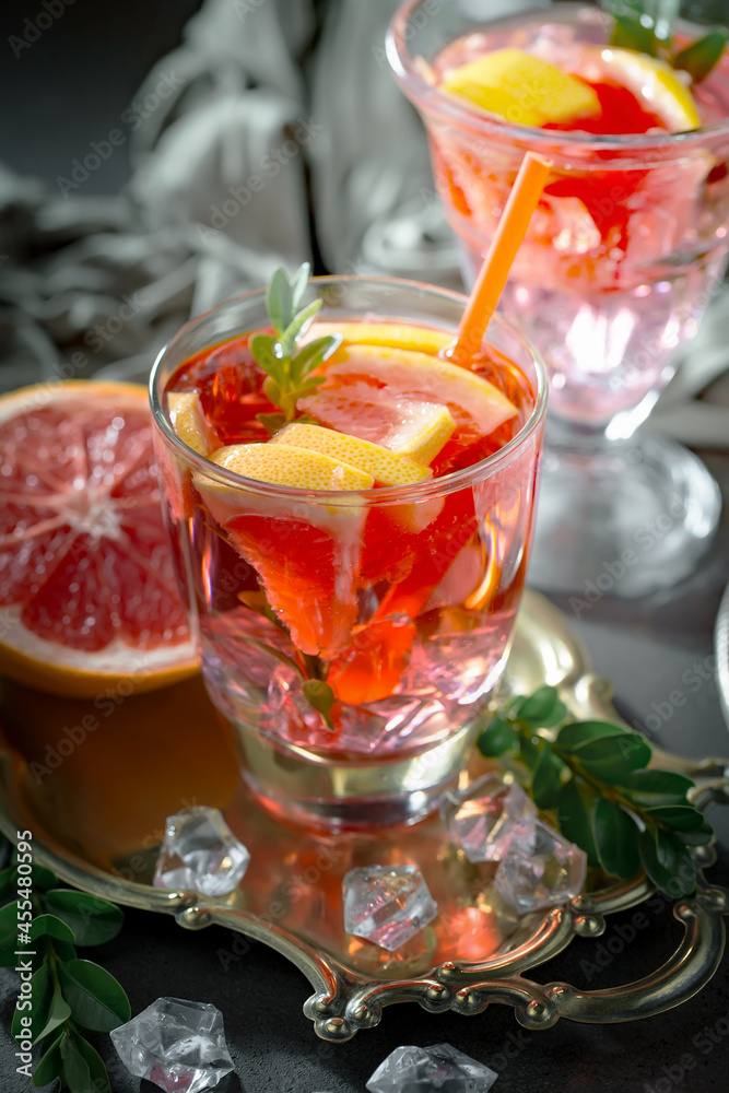 Fruit cocktail, in a glass with natural healthy fruits on a table with kitchen accessories. Fruit cocktail, in a glass with natural healthy fruits on a table with kitchen accessories.